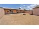 Large backyard with a covered patio and fire pit, offering ample space for recreation and relaxation at 4735 Madrigal Way, Las Vegas, NV 89122