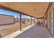 Spacious backyard with gravel and a covered patio at 4735 Madrigal Way, Las Vegas, NV 89122