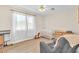 Bright bedroom with a ceiling fan, wooden floors, and a white crib at 4735 Madrigal Way, Las Vegas, NV 89122