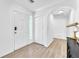 Bright foyer featuring white walls, wood floors, and a closet for storage at 4735 Madrigal Way, Las Vegas, NV 89122