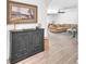 Open-concept living area with wood floors, leading to a cozy living space at 4735 Madrigal Way, Las Vegas, NV 89122