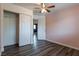 Bedroom featuring a ceiling fan, closet, and doors to other rooms at 499 Kristin Ln, Henderson, NV 89011