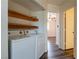 Bright laundry area with appliances and shelving at 499 Kristin Ln, Henderson, NV 89011