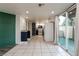 Bright, open-concept living space connecting to the kitchen and featuring a sliding glass door at 499 Kristin Ln, Henderson, NV 89011