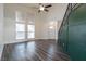 Spacious living room with updated flooring, high ceilings, and an abundance of natural light at 499 Kristin Ln, Henderson, NV 89011