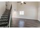 Well-lit living room with updated flooring, stairs, and a contemporary interior design at 499 Kristin Ln, Henderson, NV 89011