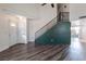 Open-concept living room with modern flooring, staircase and great natural lighting at 499 Kristin Ln, Henderson, NV 89011