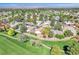 Scenic aerial view of the community nestled among lush greenery and a golf course at 5216 Desert Star Dr, Las Vegas, NV 89130