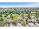 Aerial view of a home in a residential area with a golf course in the background at 5216 Desert Star Dr, Las Vegas, NV 89130