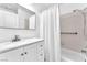 Bright bathroom with a white vanity, and a shower with a grab bar for safety at 5216 Desert Star Dr, Las Vegas, NV 89130