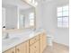 Bright bathroom with double vanity, large mirror, and a window for natural light at 5216 Desert Star Dr, Las Vegas, NV 89130