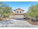 Two-story home with a three-car garage, tile roof, neutral paint, and desert landscaping at 5216 Desert Star Dr, Las Vegas, NV 89130