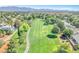 Scenic aerial view of the community nestled among lush greenery and a golf course at 5216 Desert Star Dr, Las Vegas, NV 89130