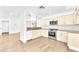 Bright open kitchen with modern appliances and adjacent living area at 5216 Desert Star Dr, Las Vegas, NV 89130