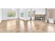 Bright and airy living room featuring hardwood floors, a fireplace, and ample natural light at 5216 Desert Star Dr, Las Vegas, NV 89130
