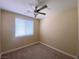 Bright bedroom features a ceiling fan, window, and neutral walls, creating a serene and inviting atmosphere at 5376 S Conquistador St, Las Vegas, NV 89148