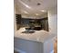 Stylish kitchen boasts stainless steel appliances, sleek countertops, and modern cabinetry with matching backsplash at 5376 S Conquistador St, Las Vegas, NV 89148