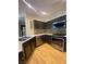 Stylish kitchen boasts stainless steel appliances, sleek countertops, and modern cabinetry with matching backsplash at 5376 S Conquistador St, Las Vegas, NV 89148