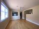 Bright living room featuring hardwood floors, abundant natural light, and open space to the other rooms at 5376 S Conquistador St, Las Vegas, NV 89148