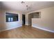 Bright living room featuring hardwood floors, abundant natural light, and open space to the other rooms at 5376 S Conquistador St, Las Vegas, NV 89148