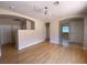 Bright living room featuring hardwood floors, abundant natural light, and open space to the other rooms at 5376 S Conquistador St, Las Vegas, NV 89148