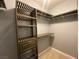 Custom walk-in closet offering an abundance of space with shelving, drawers, rods, and wire baskets at 5376 S Conquistador St, Las Vegas, NV 89148