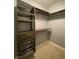 Well-organized walk-in closet with shelving, drawers, rods, and wire baskets for optimal storage at 5376 S Conquistador St, Las Vegas, NV 89148