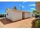 Spacious backyard with gravel landscaping, privacy fence, and an outbuilding or shed at 557 6Th St, Boulder City, NV 89005