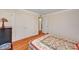 Cozy bedroom featuring a quaint quilt, wood floors, and a double door closet for ample storage at 557 6Th St, Boulder City, NV 89005