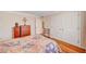 Cozy bedroom showcasing hardwood floors, a large bed, and double closets at 557 6Th St, Boulder City, NV 89005