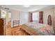 Bright bedroom featuring hardwood floors, double closets, and stylish patterned curtains at 557 6Th St, Boulder City, NV 89005
