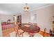 A dining room featuring a wooden table with chairs and an overhead light fixture at 557 6Th St, Boulder City, NV 89005