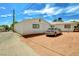 Exterior side view of the home showcasing a long driveway and a parked car at 557 6Th St, Boulder City, NV 89005