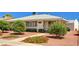 Charming home with a well-manicured front yard and walkway, perfect for curb appeal at 557 6Th St, Boulder City, NV 89005