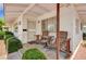Inviting front porch features chairs, providing a cozy outdoor seating area with a nice curb appeal at 557 6Th St, Boulder City, NV 89005