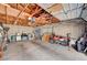 Spacious garage interior with a motorcycle, washer, dryer, and ample storage at 557 6Th St, Boulder City, NV 89005