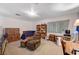 A comfortable living room with a bed, chair, and work desk provides comfortable living at 557 6Th St, Boulder City, NV 89005