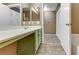 Bathroom featuring light green vanity, and walk-in shower at 5655 E Sahara Ave # 1052, Las Vegas, NV 89142