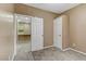 Cozy bedroom adjacent to kitchen has plush carpet and closet storage at 5655 E Sahara Ave # 1052, Las Vegas, NV 89142