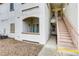 An exterior view of the property with stairs leading to upper-level units at 5655 E Sahara Ave # 1052, Las Vegas, NV 89142