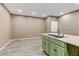 Spacious kitchen with green cabinets, light countertops and luxury vinyl plank flooring at 5655 E Sahara Ave # 1052, Las Vegas, NV 89142