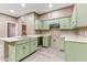 Bright kitchen features light green cabinetry, laminate countertops and stainless steel sink at 5655 E Sahara Ave # 1052, Las Vegas, NV 89142