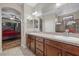 Luxurious bathroom featuring double sinks and granite countertops at 5745 Sagamore Canyon St, North Las Vegas, NV 89081