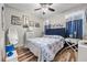 Cozy bedroom with patterned bedding, wood floors, and natural light at 5745 Sagamore Canyon St, North Las Vegas, NV 89081
