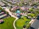 Aerial view of the community clubhouse, showcasing its pool, putting green, and well-maintained landscaping at 5745 Sagamore Canyon St, North Las Vegas, NV 89081