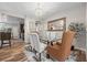 Elegant dining room with a glass table, stylish chairs, and sophisticated lighting at 5745 Sagamore Canyon St, North Las Vegas, NV 89081