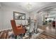 Elegant dining room with a glass table, stylish chairs, and sophisticated lighting at 5745 Sagamore Canyon St, North Las Vegas, NV 89081