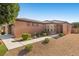 Charming single-story home featuring a desert landscape, tile roof, and well-maintained yard at 5745 Sagamore Canyon St, North Las Vegas, NV 89081