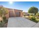 Charming home featuring well-manicured landscaping and a spacious two-car garage at 5745 Sagamore Canyon St, North Las Vegas, NV 89081