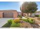 Charming home featuring well-manicured landscaping and a spacious two-car garage at 5745 Sagamore Canyon St, North Las Vegas, NV 89081